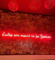 Rules are meant to be broken, neon sign