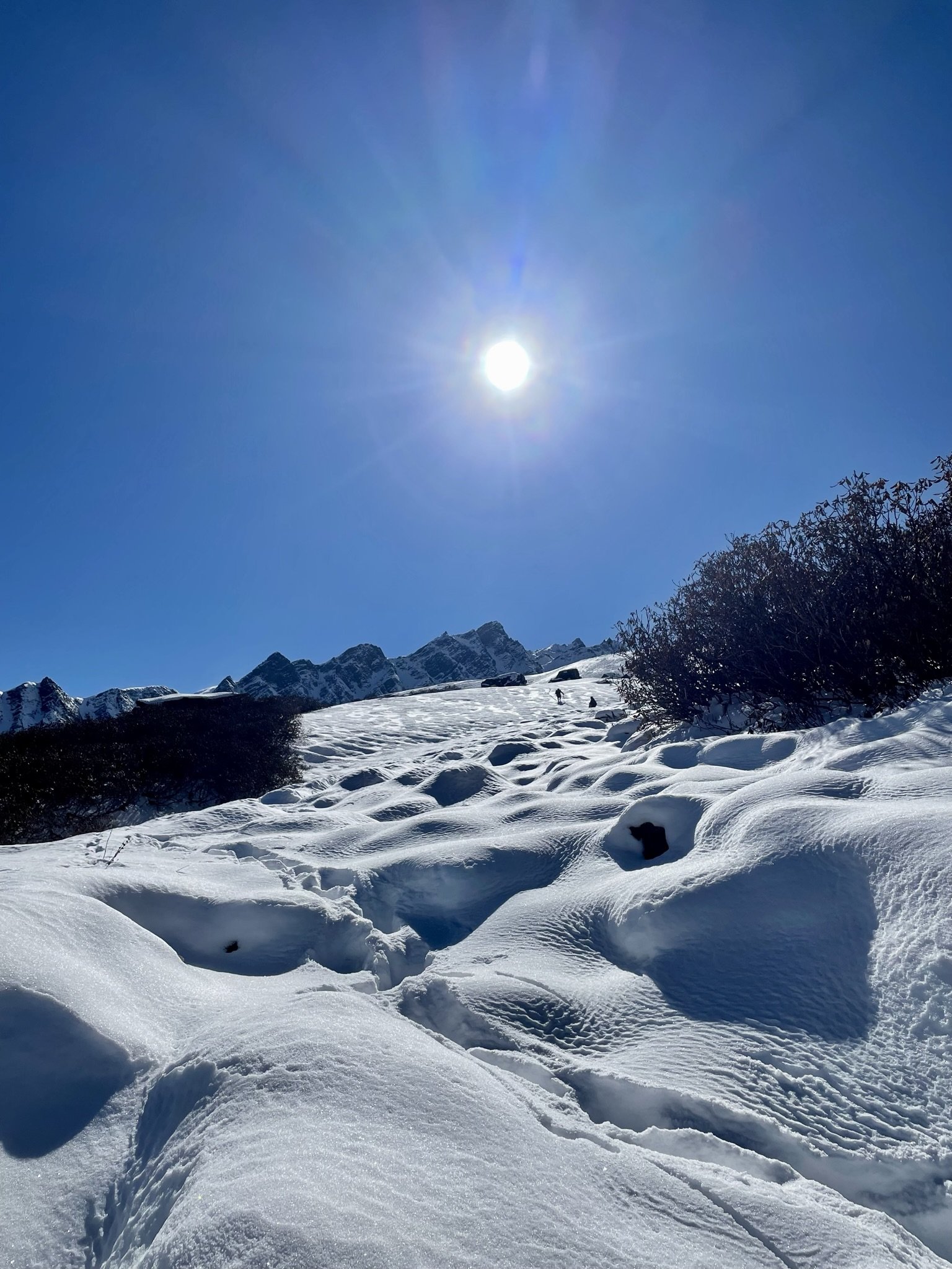 Mountain summit in the Himalayas with sun