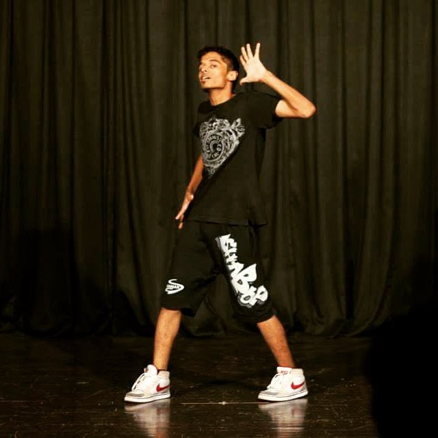 Kartik performing hip-hop on stage — early dance days