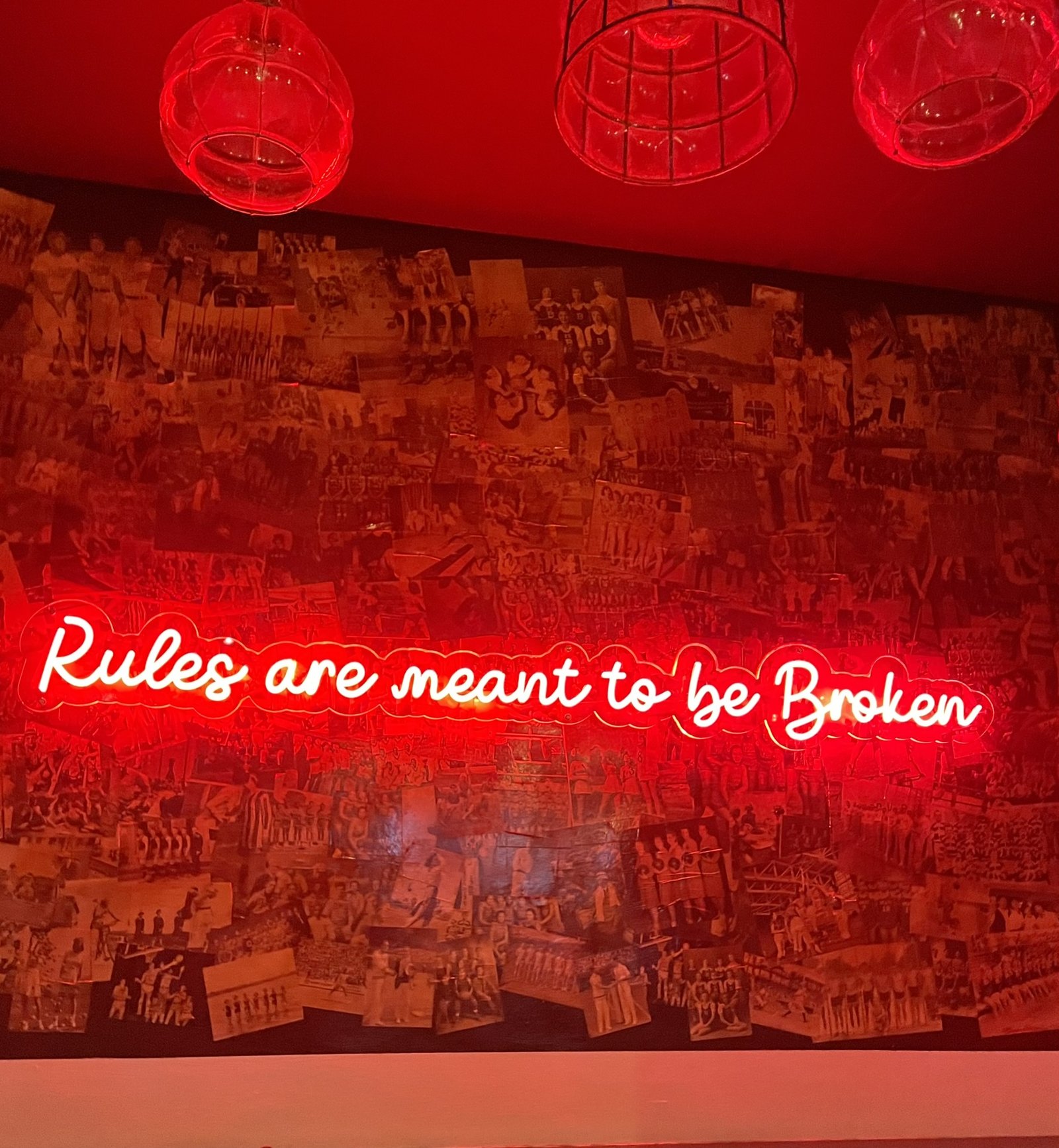 Rules are meant to be broken — neon sign